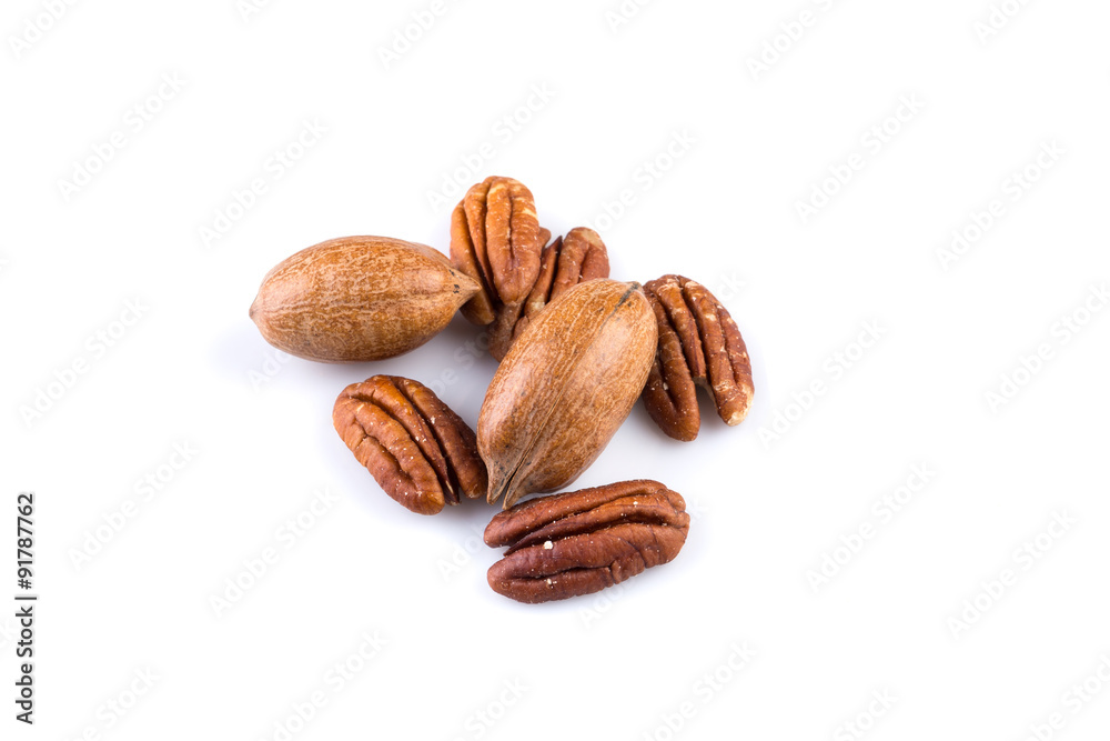 Few pecan nuts isolated on white Few pecan nuts isolated on white