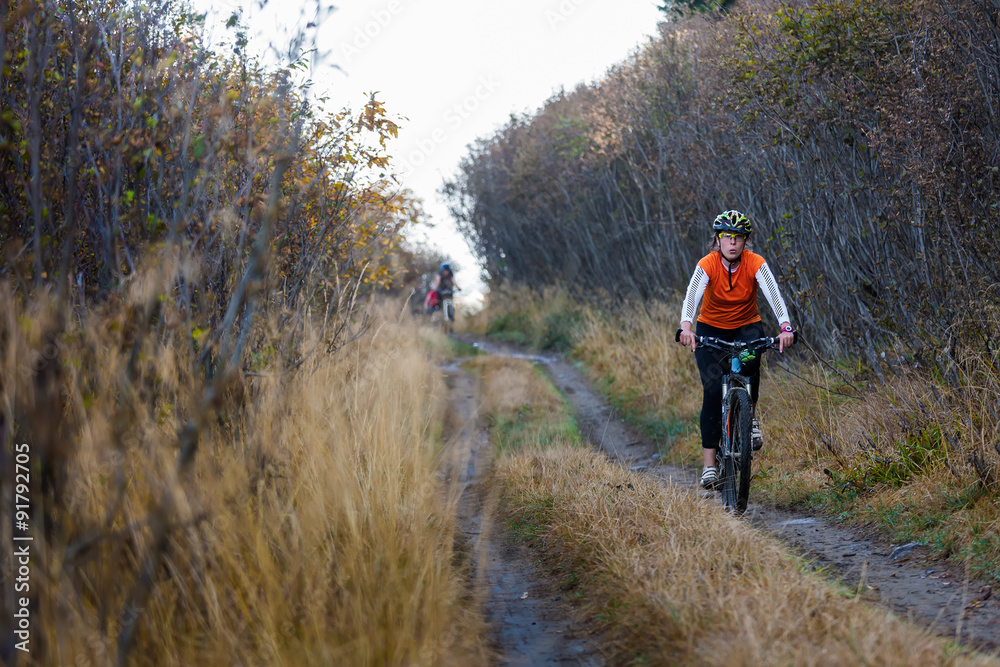 Mountain biker in autumn forest Mountain biker in autumn forest