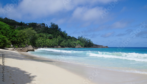Sandy Anse Takamaka beach in Mahe, Seychelles