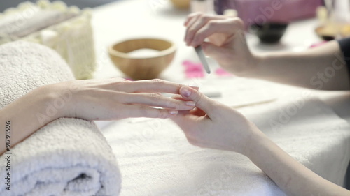 Manicure treatment at nail salon