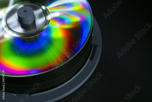 Isolated shot of compact discs on black background