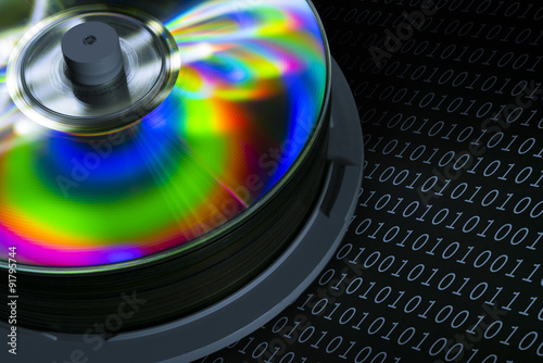 Isolated shot of compact discs on black background photo