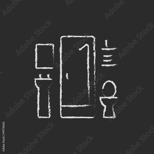 Bathroom icon drawn in chalk.