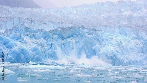 Calving of the tidewater South Sawyer Glacier in Tracy Arm - Fords Terror Wilderness in Southeast Alaska. photo