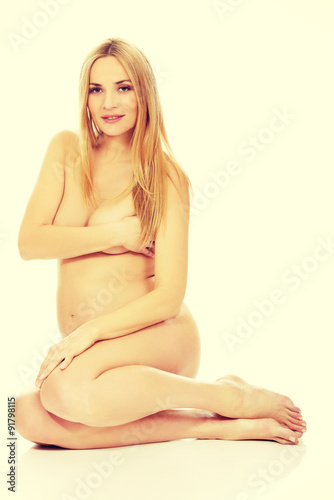 Pregnant woman sitting on the floor