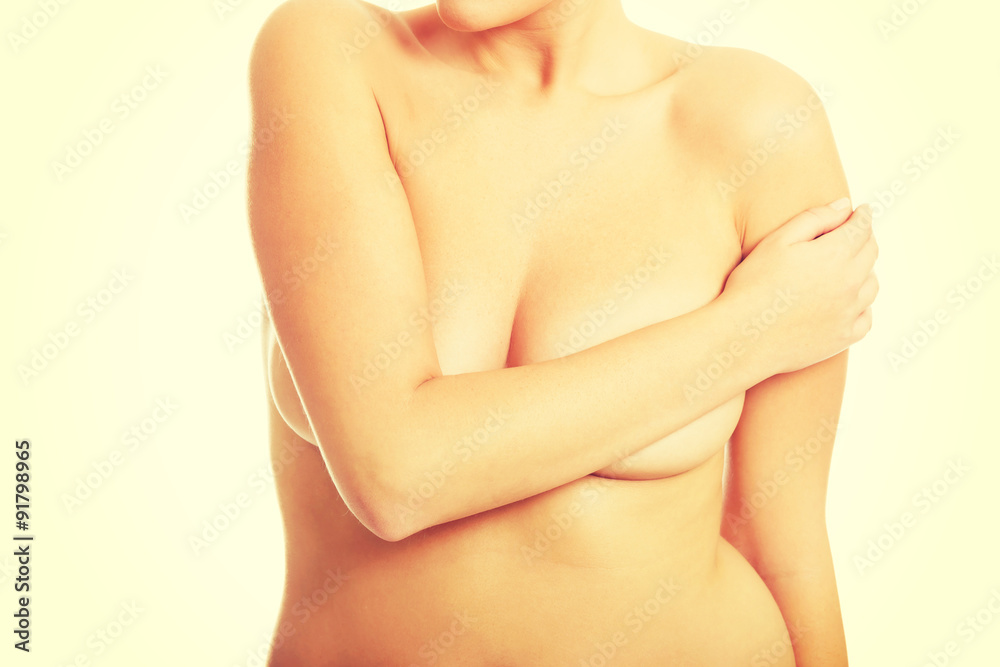 Fototapeta premium Topless woman covering her breast