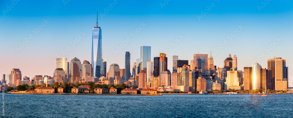 Downtown New York skyline panorama with Ellis Island in the foreground