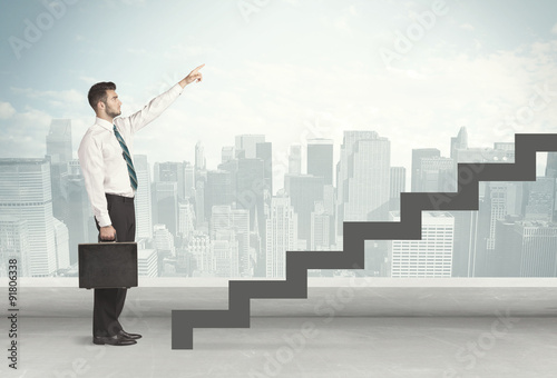 Business person in front of a staircase