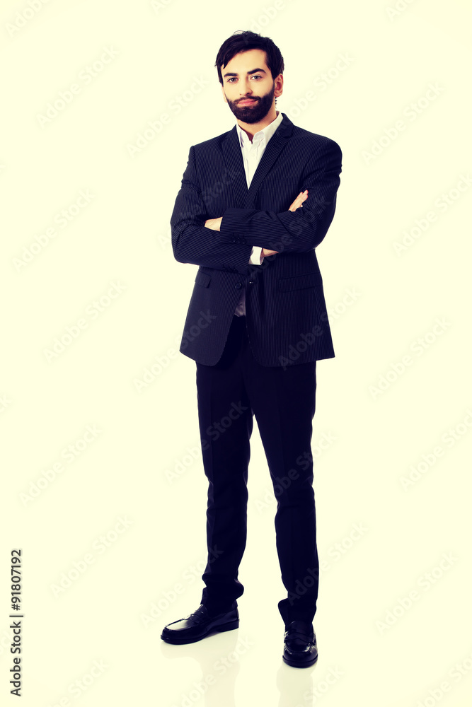 Smiling businessman with folded arms. Smiling businessman with folded arms.
