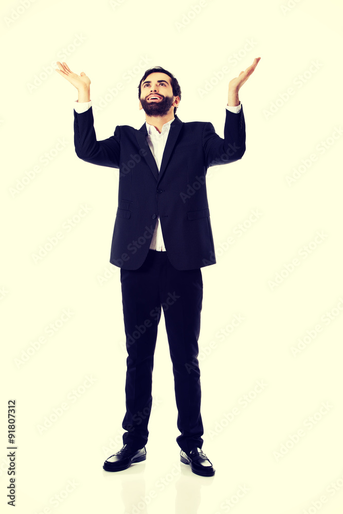 Businessman showing empty copyspace in hands. Businessman showing empty copyspace in hands.