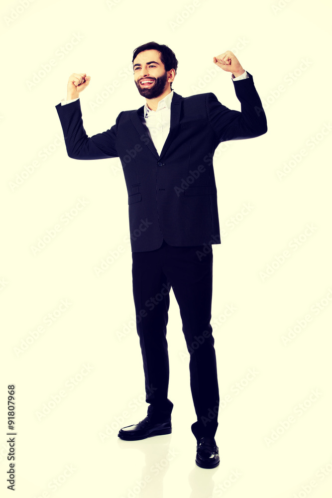 Businessman making fists in a winner gesture. Businessman making fists in a winner gesture.