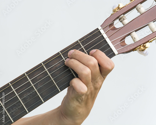  hand playing on guitar