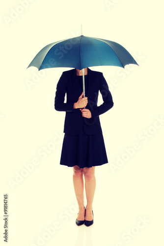 Wallpaper Mural Business woman is holding blue umbrella.  Torontodigital.ca