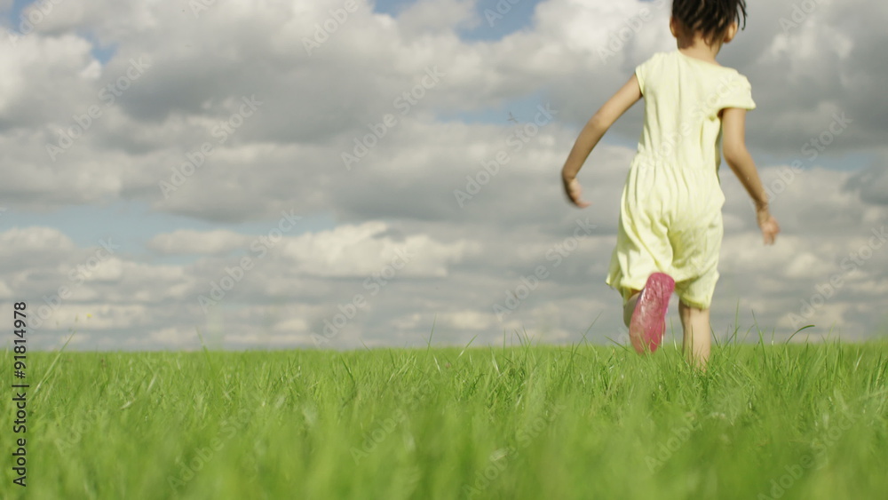 4K Little girl in a yellow dress running into a wide open green area, in slow motion, shot on Red Epic Dragon 4K Little girl in a yellow dress running into a wide open green area, in slow motion, shot on Red Epic Dragon