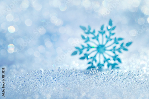 Christmas background with icy blurred decorative snowflake