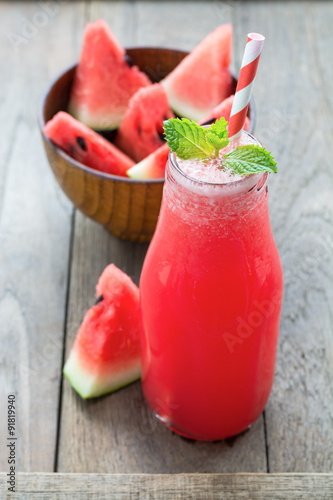 Watermelon smoothie on a rustic wood table background, Iced wate