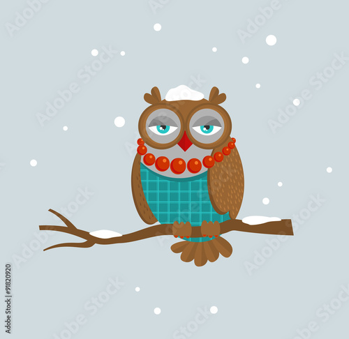 The portrait of fashionable owl on the branch.