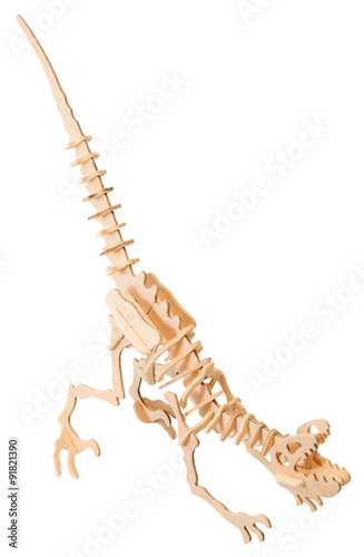 wooden dinosaur isolated on a white background