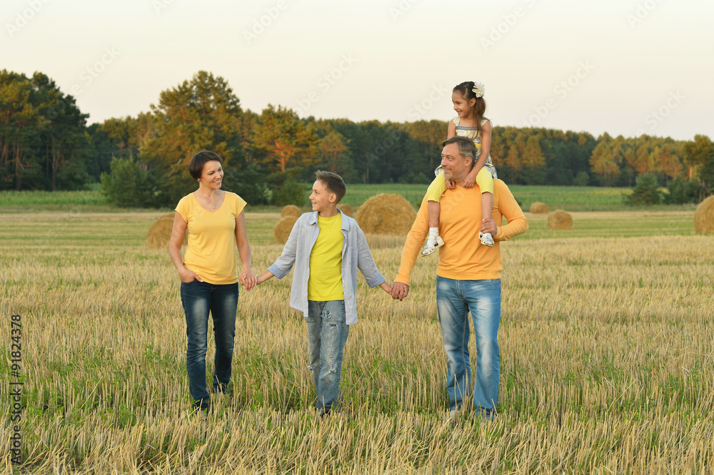 Happy family in wheat field