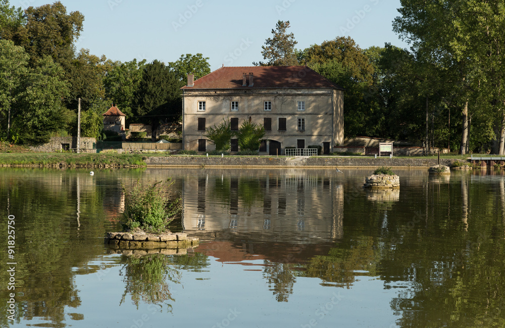 house reflected in the Burgundy Canal, France