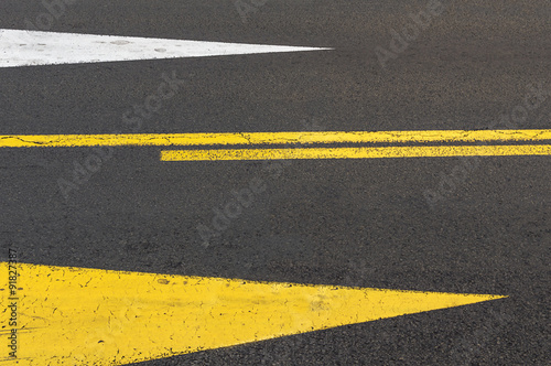 Directional arrows on asphalt road. © maticsandra