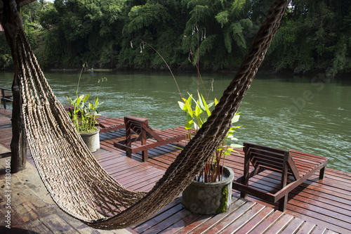 Hammock hanging at the balcony beside the river