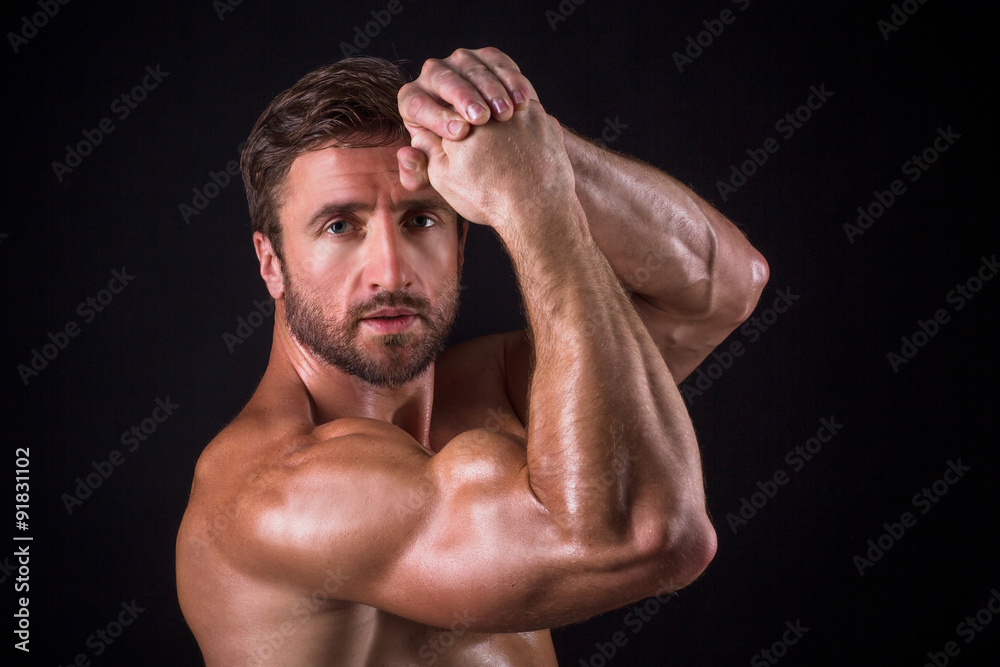 Fototapeta premium Serious shirtless mascular man