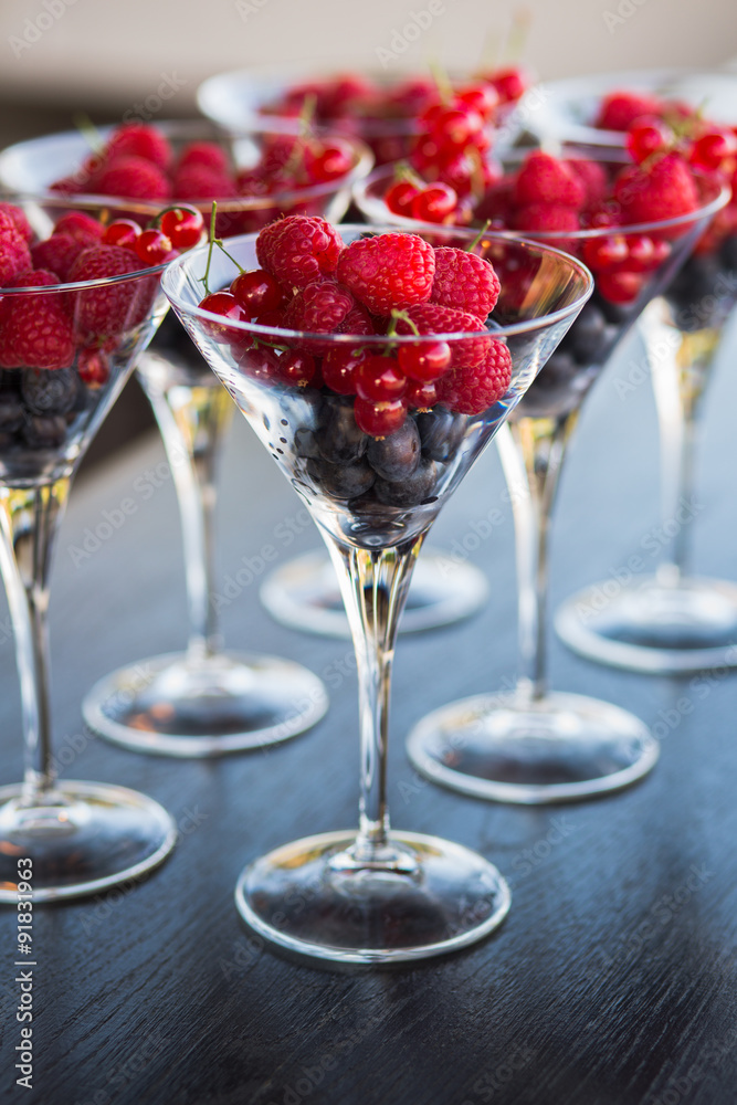 Many glasses of blueberry, raspberry, currant Many glasses of blueberry, raspberry, currant