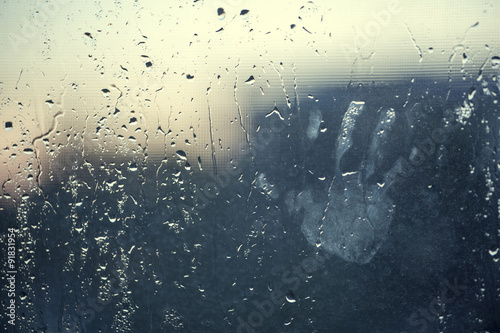 water drops background with chid's hand