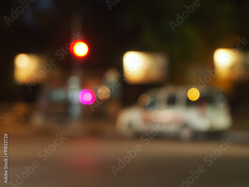 Defocused silhouette of the car and traffic lights © romensky