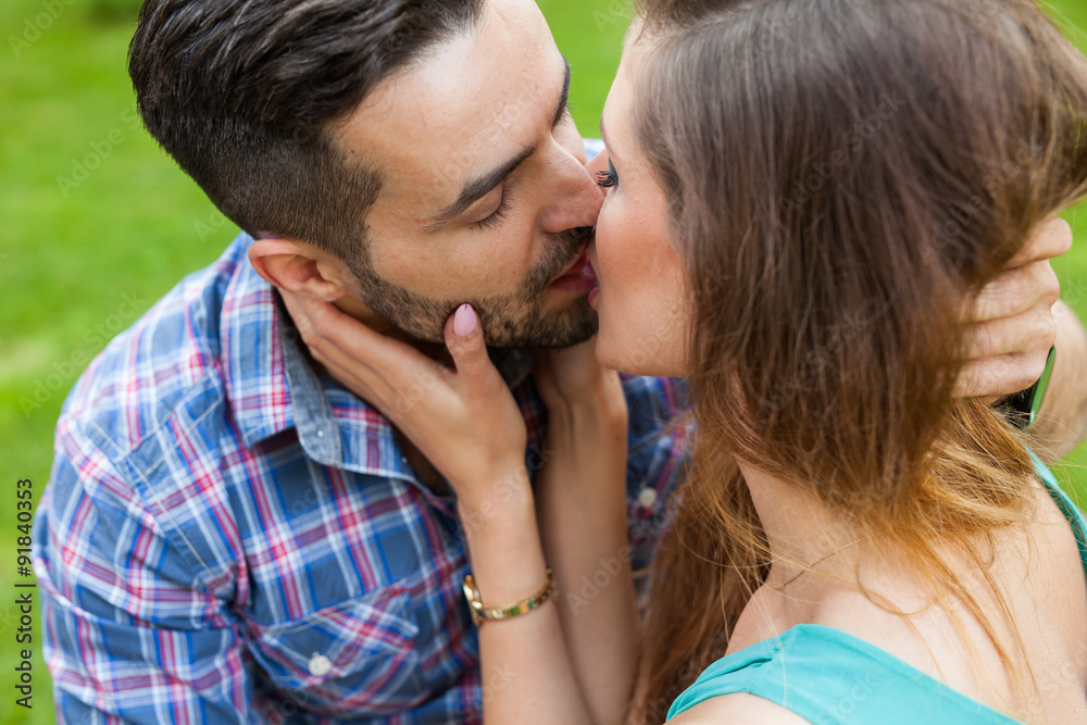 Couple sitting on the bench in garden, they are in love. Couple sitting on the bench in garden, they are in love.