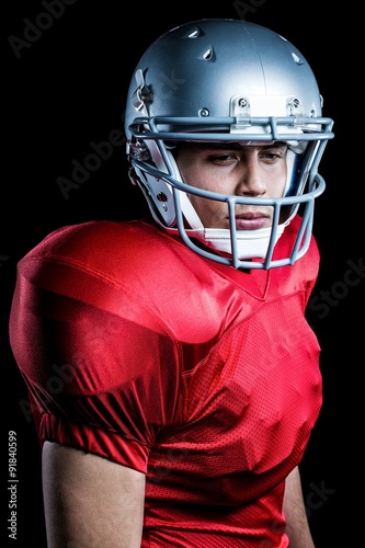 Close-up of confident American football player