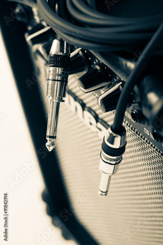 Close-up of guitar amplifier with jack cable