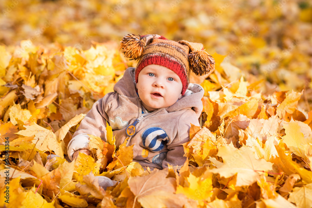 Cute baby in autumn leaves. Cute baby in autumn leaves.