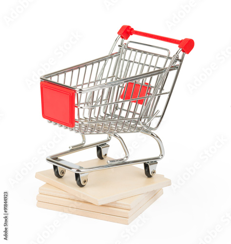 Shopping cart on paving tiles, side view