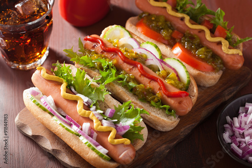 grilled hot dogs with vegetables ketchup mustard