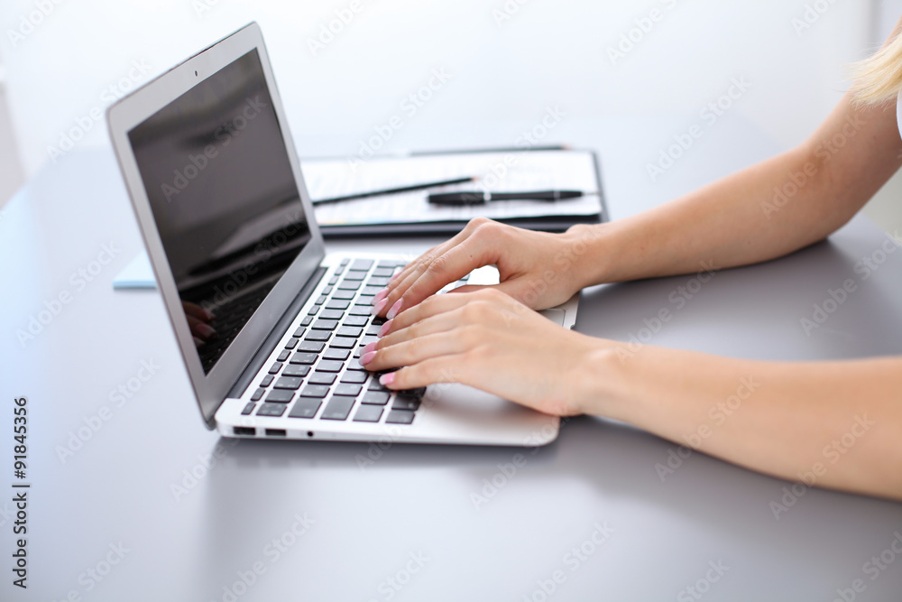 Close up of business woman hands typing on laptop computer Close up of business woman hands typing on laptop computer