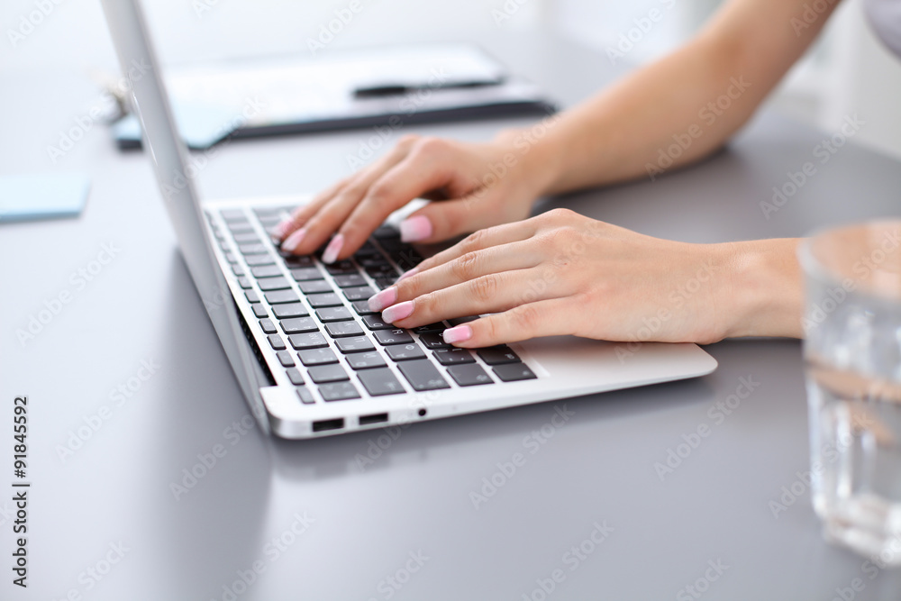 Close up of business woman hands typing on laptop computer Close up of business woman hands typing on laptop computer