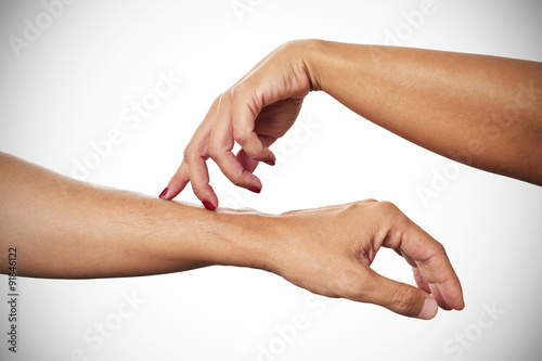 Fotografija woman caressing with her fingertips the arm of a man
