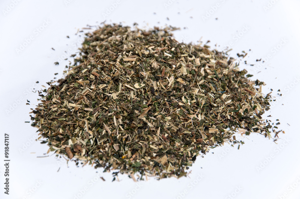 A bunch of nettle tea over white surface A bunch of nettle tea over white surface
