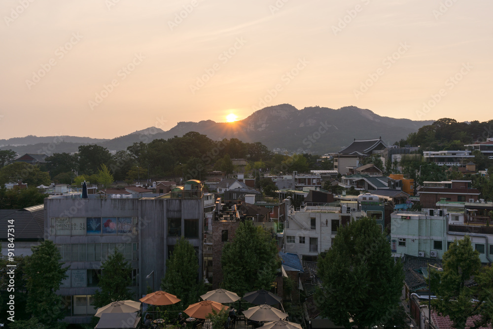 samcheongdong sunset view taken from bukchon hanok village in seoul, south korea