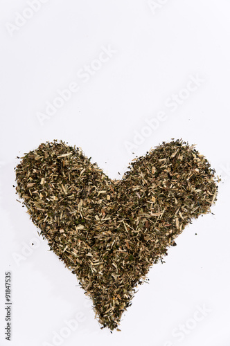 Heart of nettle tea on the white background