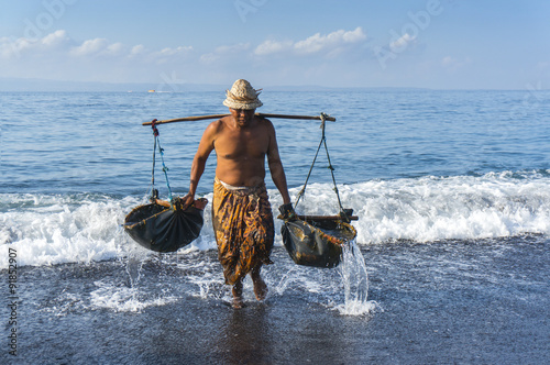 Traditional salt farmer photo