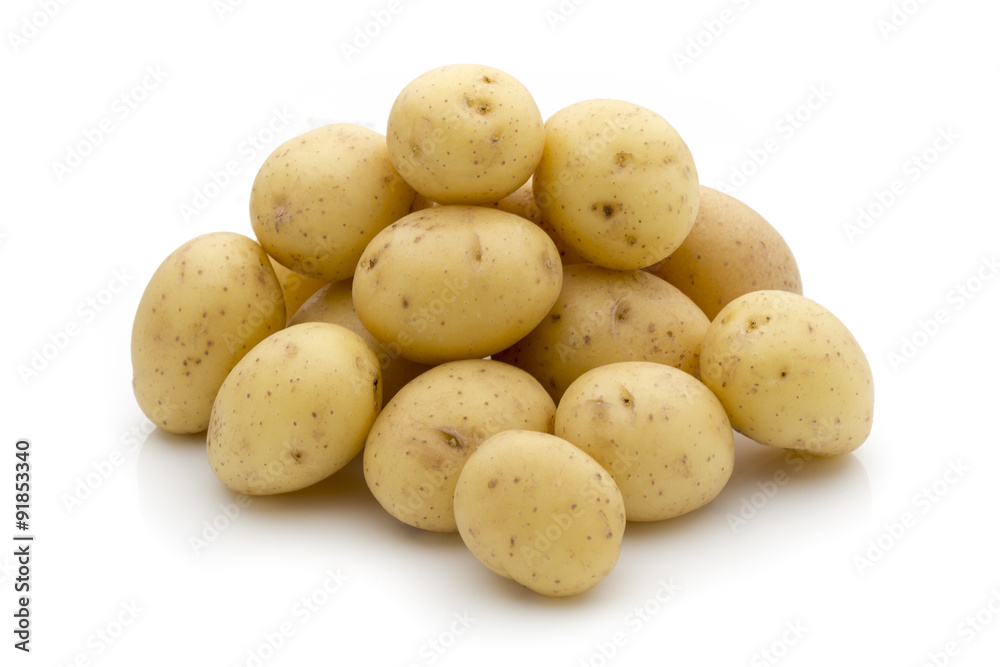 Potatoes on the white background. New harvest. Potatoes on the white background. New harvest.