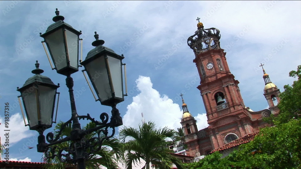Steeples rise above the top of a church. Steeples rise above the top of a church.