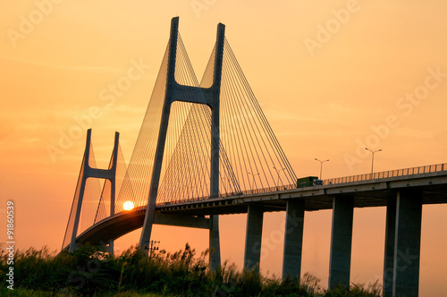 Fototapeta Naklejka Na Ścianę i Meble -  Phu My brigde at sunset. This is the important bridge linking district 2 and district 7 in Ho Chi Minh city, Vietnam