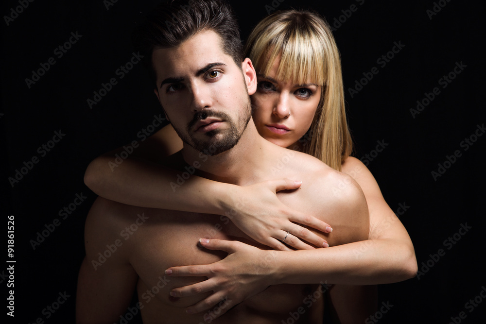 Young couple in love on black background Young couple in love on black background