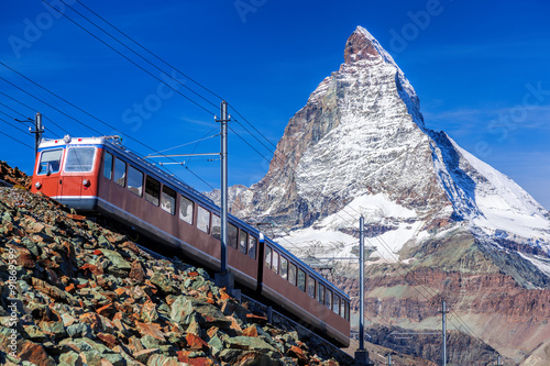 Matterhorn peak with a train in Switzerland 