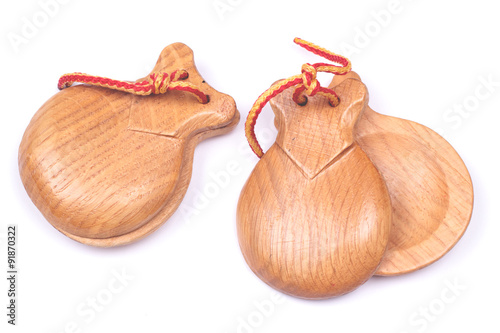 A pair of wooden spanish castanets isolated on white background