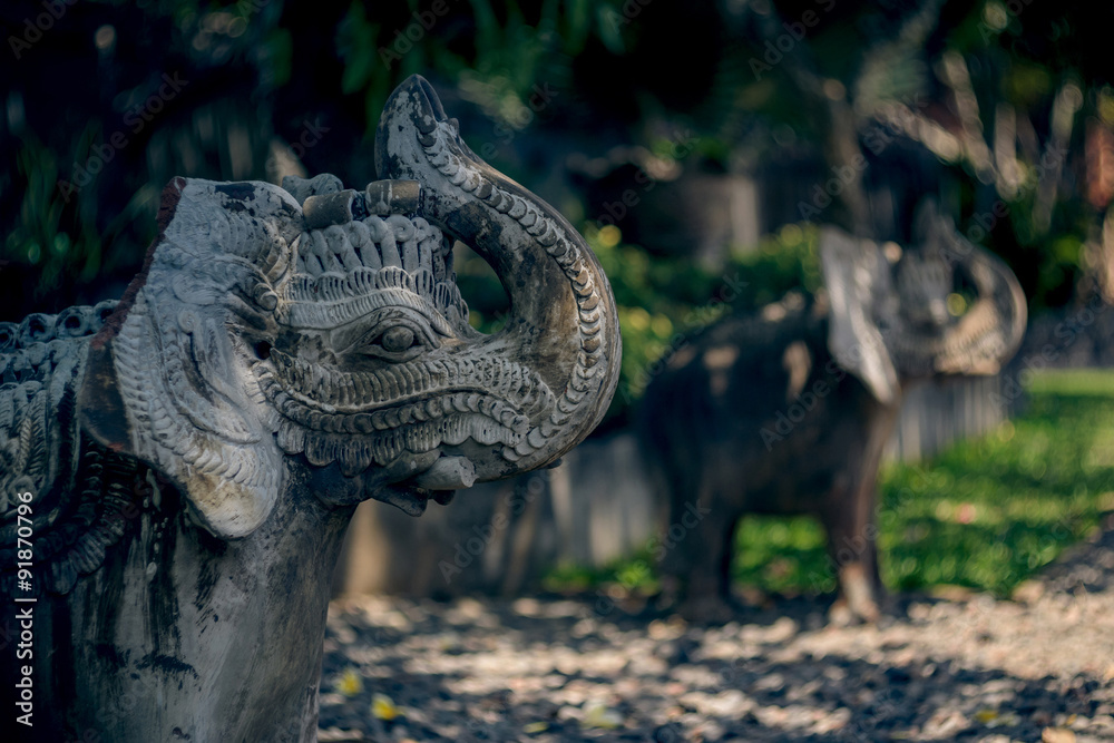 Fototapeta premium Beautiful statues of elephants on Bali island. Stone carving.